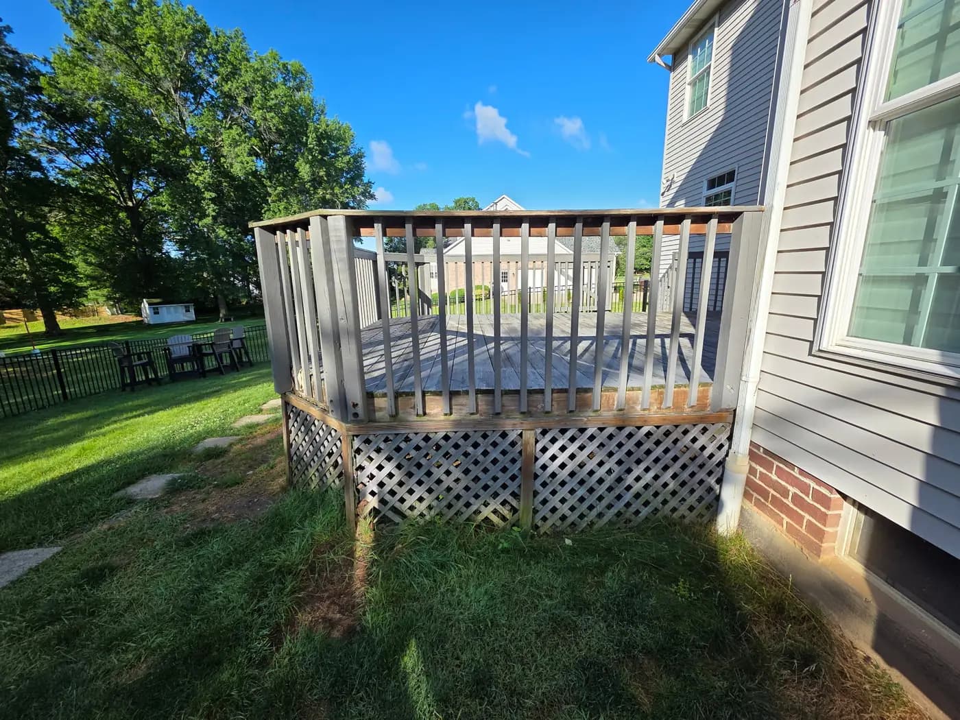 Weathered gray deck before the rebuild