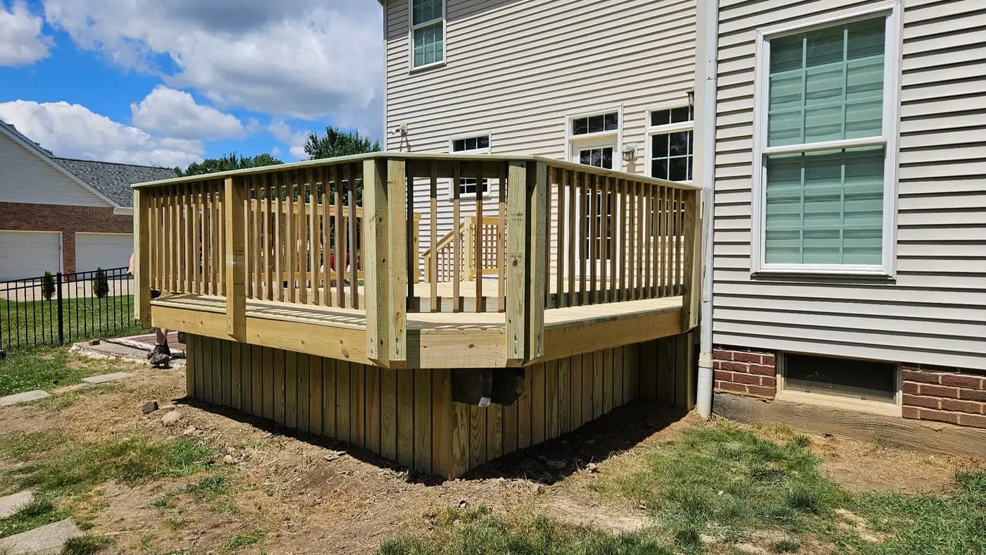 New pressure-treated deck with railings and skirting